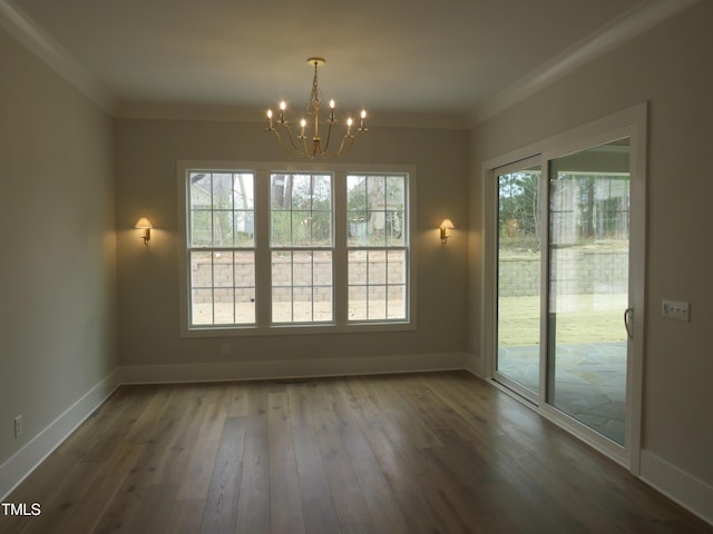 unfurnished dining area with crown molding, a notable chandelier, and a healthy amount of sunlight