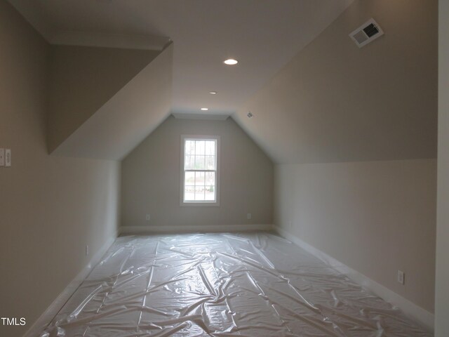 bonus room featuring visible vents, recessed lighting, baseboards, and vaulted ceiling