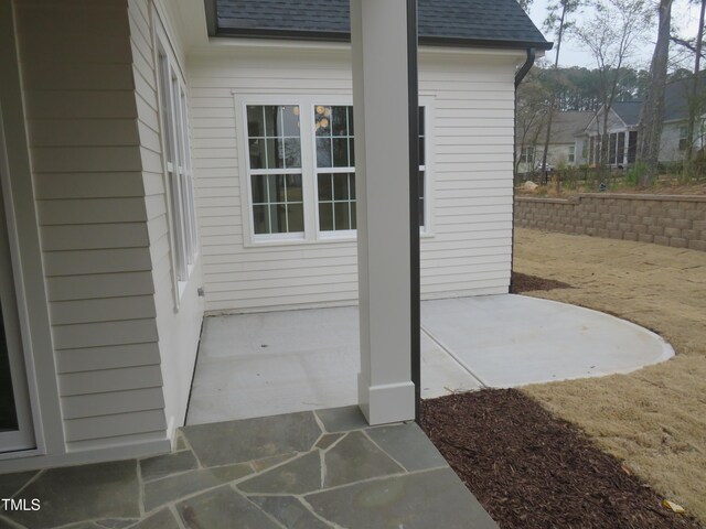 exterior space with a shingled roof