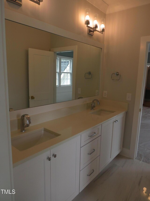 bathroom featuring double vanity and a sink