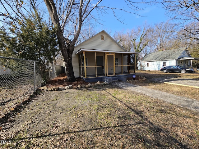 rear view of house with covered porch