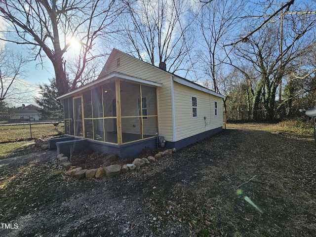 view of home's exterior featuring a sunroom