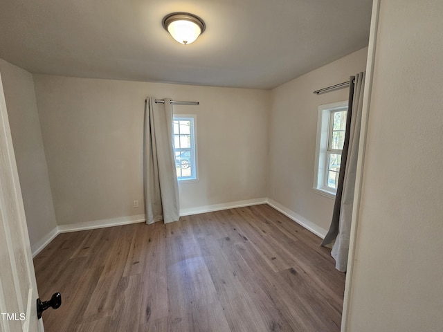 spare room with light wood-type flooring