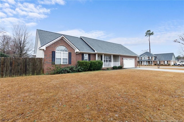 single story home featuring a garage and a front lawn