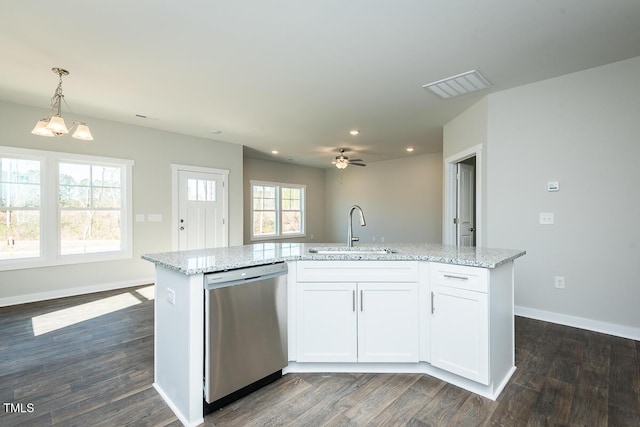 kitchen featuring sink, a kitchen island with sink, hanging light fixtures, white cabinets, and stainless steel dishwasher