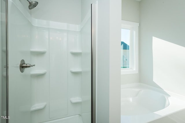 bathroom with shower with separate bathtub