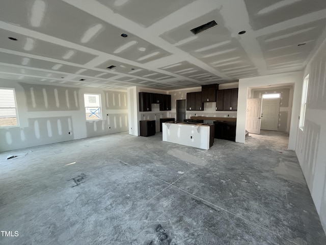 kitchen with dark brown cabinets and a center island