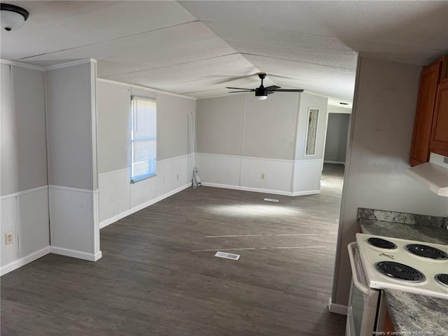 interior space with dark wood-type flooring, ceiling fan, and lofted ceiling