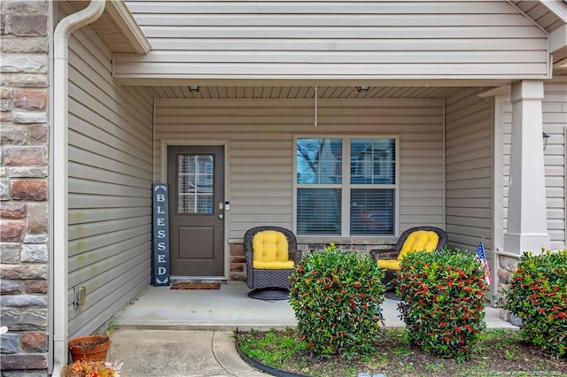 doorway to property featuring a porch