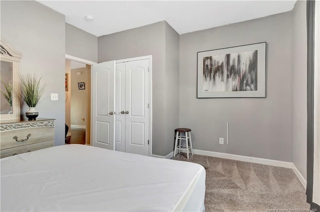 carpeted bedroom with a closet