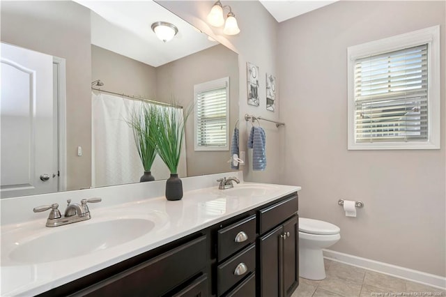 bathroom with vanity, tile patterned flooring, a shower with curtain, and toilet