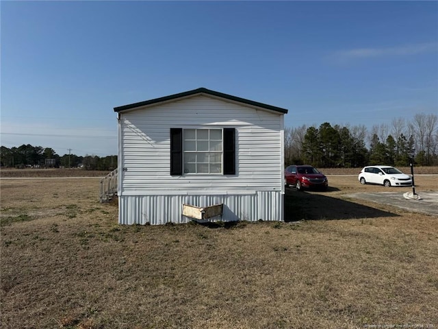 view of property exterior featuring a yard