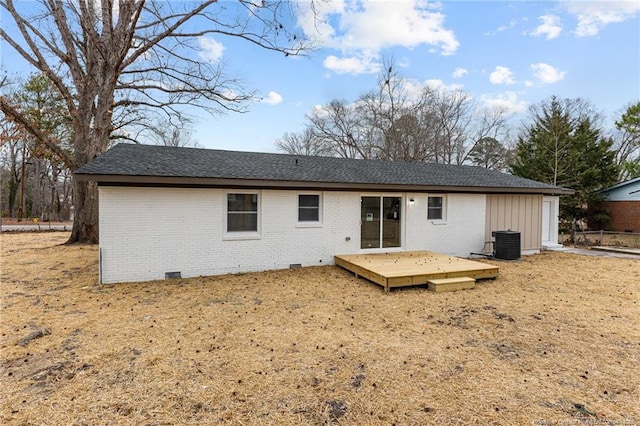 rear view of house featuring crawl space, brick siding, central AC unit, and a wooden deck