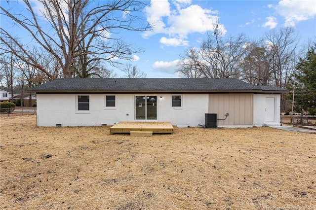 rear view of house with a deck, central air condition unit, and brick siding