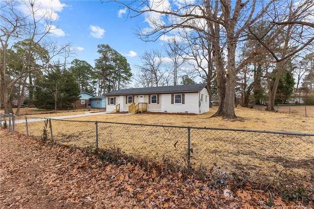 ranch-style home with crawl space and a fenced front yard