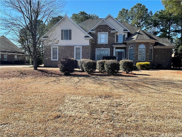 view of property with a front lawn