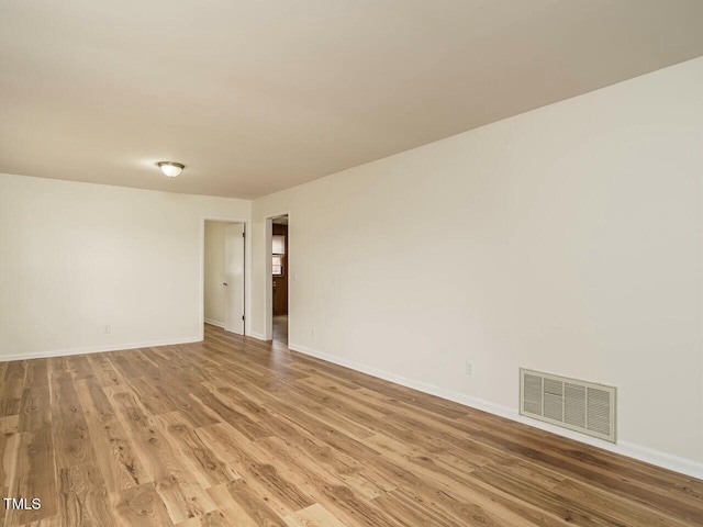 unfurnished room featuring light hardwood / wood-style flooring