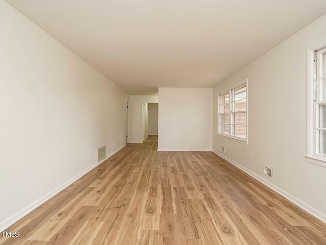 unfurnished room with light hardwood / wood-style floors