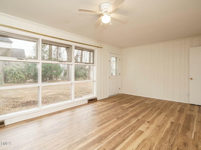 interior space with ceiling fan and light wood-type flooring