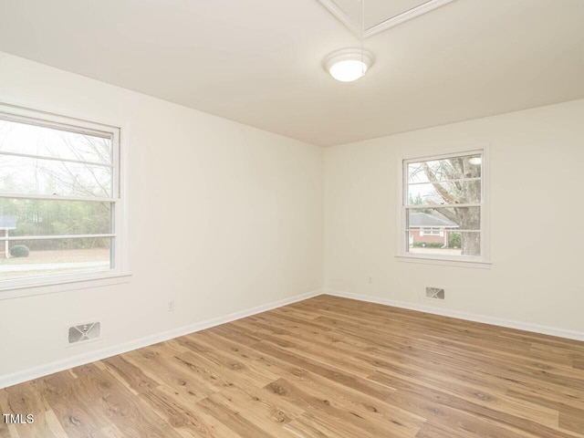 unfurnished room featuring light wood-type flooring