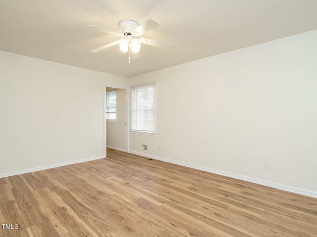 spare room featuring light hardwood / wood-style floors and ceiling fan