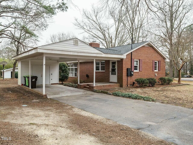 view of front of home featuring a carport