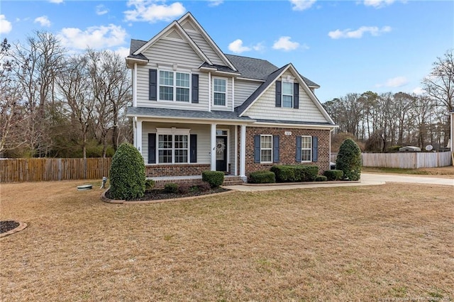 craftsman-style home with a front lawn