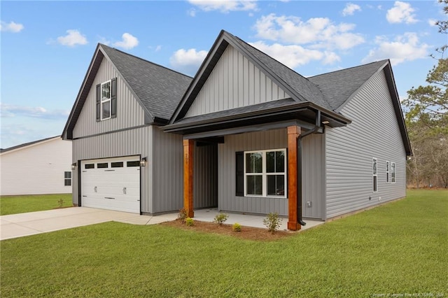 view of front of home featuring a garage, a front lawn, and a porch