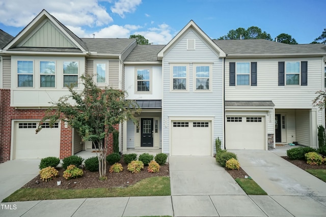 townhome / multi-family property featuring a garage