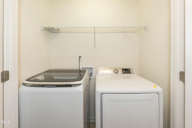 washroom with separate washer and dryer