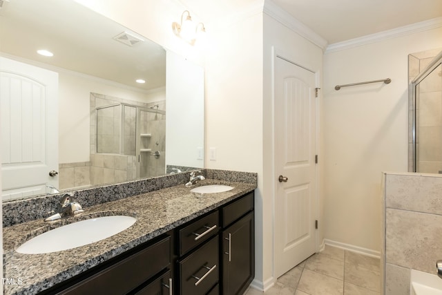 bathroom featuring tile patterned flooring, vanity, an enclosed shower, and crown molding