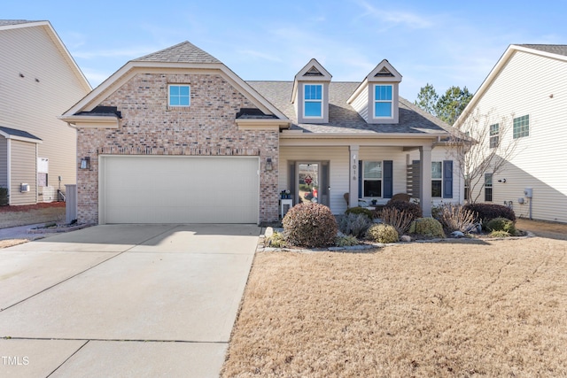 view of front facade with a garage and covered porch