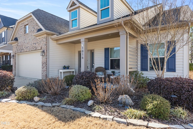 view of front facade featuring a garage and covered porch