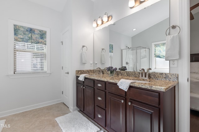 bathroom featuring lofted ceiling, vanity, an enclosed shower, and tile patterned floors