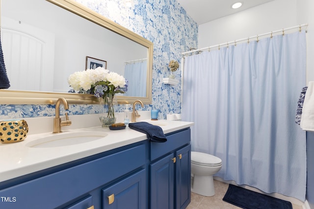 bathroom featuring a shower with curtain, vanity, toilet, and tile patterned flooring