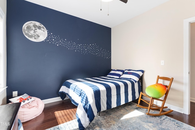 bedroom featuring ceiling fan and dark hardwood / wood-style flooring