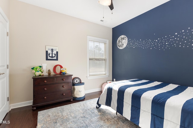 bedroom featuring dark hardwood / wood-style floors and ceiling fan