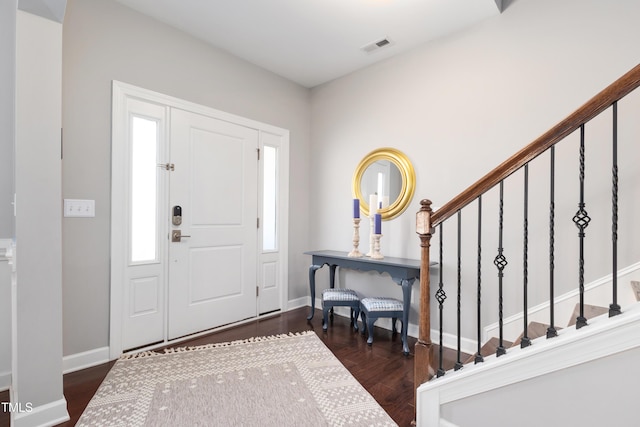 foyer entrance featuring dark wood-type flooring