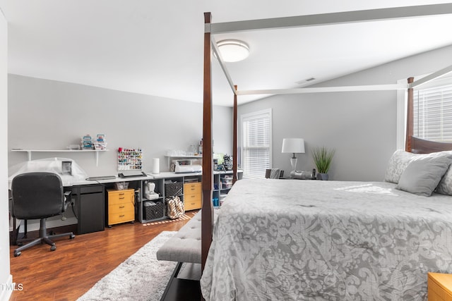 bedroom with dark hardwood / wood-style flooring