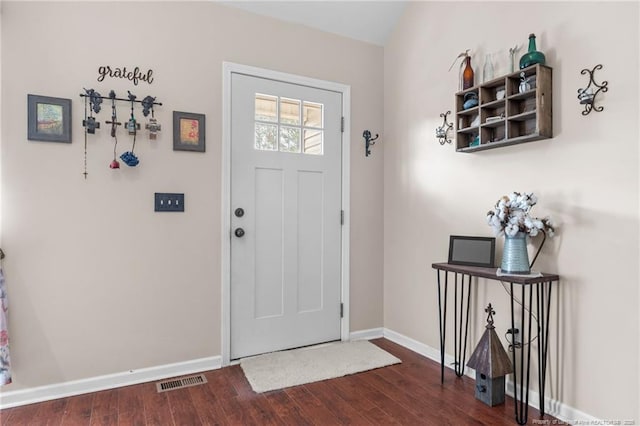 entryway with dark hardwood / wood-style flooring