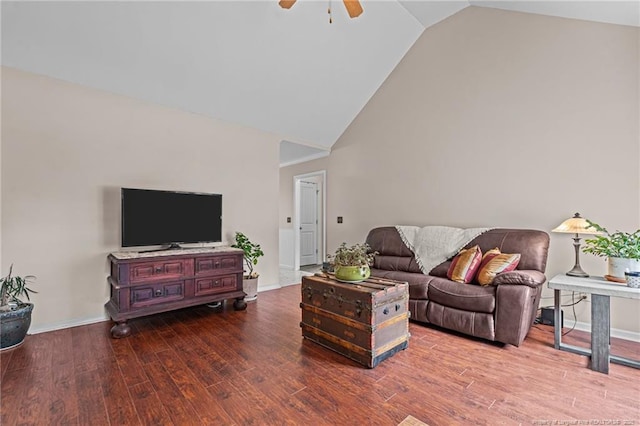 living room with hardwood / wood-style floors, high vaulted ceiling, and ceiling fan