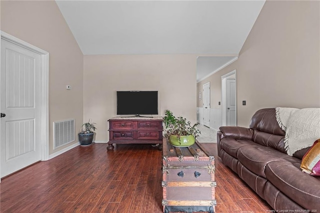 living room with lofted ceiling and dark hardwood / wood-style flooring