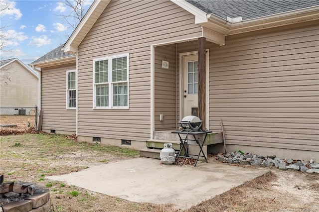 entrance to property featuring a patio