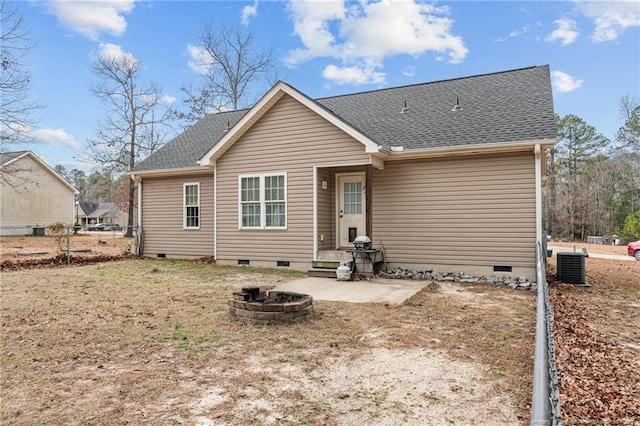 back of house with central AC, an outdoor fire pit, and a patio area