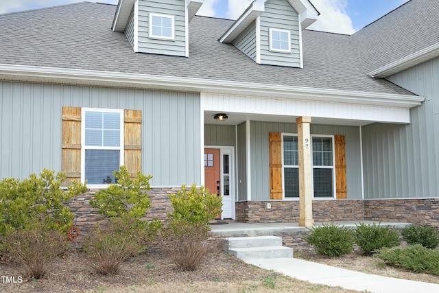 view of exterior entry with a porch