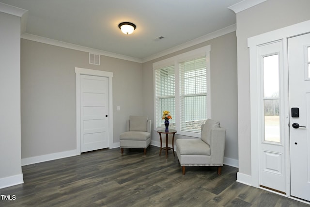 sitting room featuring ornamental molding and dark hardwood / wood-style floors