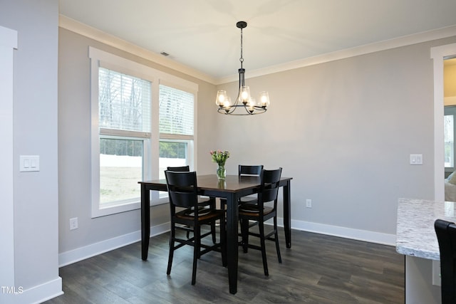 dining space with crown molding, dark hardwood / wood-style floors, and a chandelier