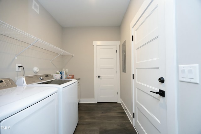 clothes washing area with cabinets, separate washer and dryer, dark wood-type flooring, and electric panel