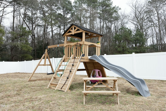 view of jungle gym with a lawn