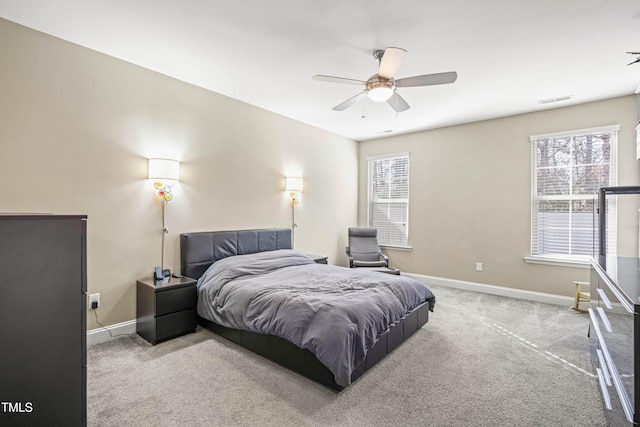 bedroom featuring carpet, a ceiling fan, and baseboards